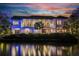 Waterfront property featuring backyard, outdoor living space, and waterfront views at 212 Haverkos Ct, Holmes Beach, FL 34217