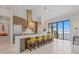 Modern kitchen with a large island, stainless steel appliances, and counter seating at 212 Haverkos Ct, Holmes Beach, FL 34217