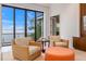 Cozy sitting area features water views, comfortable chairs, and plenty of natural light at 212 Haverkos Ct, Holmes Beach, FL 34217