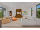 Spacious living room featuring a modern entertainment center, comfortable seating, and stylish decor at 212 Haverkos Ct, Holmes Beach, FL 34217