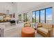 Open concept living area offering great water views and a seamless transition to the kitchen at 212 Haverkos Ct, Holmes Beach, FL 34217
