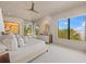 Bright and airy main bedroom featuring water views, natural light, and neutral decor at 212 Haverkos Ct, Holmes Beach, FL 34217