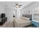 Calm bedroom with natural light, soft carpet and access to a full bathroom at 220 Cassano Dr, Nokomis, FL 34275