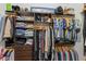 Spacious walk-in closet with custom shelving and ample hanging space for organized storage at 220 Cassano Dr, Nokomis, FL 34275