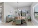 Bright dining room with plenty of natural light and stylish decor at 220 Cassano Dr, Nokomis, FL 34275