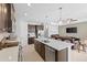 Bright kitchen features stainless steel appliances, dark wood cabinets and a large island at 220 Cassano Dr, Nokomis, FL 34275