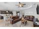 Open concept living area with modern furniture, kitchen and lots of natural light at 220 Cassano Dr, Nokomis, FL 34275