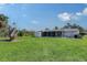 Large backyard featuring a shed and screened-in porch at 2406 Breakwater Cir, Sarasota, FL 34231