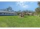 Backyard area with lush green grass at 2406 Breakwater Cir, Sarasota, FL 34231