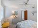 Bright bedroom featuring a ceiling fan and wicker nightstand for a cozy feel at 2406 Breakwater Cir, Sarasota, FL 34231
