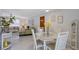 Cozy dining area featuring a glass-top table, seating for four, and an open concept at 2406 Breakwater Cir, Sarasota, FL 34231