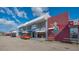 Commercial building featuring multiple businesses and colorful signage, creating a vibrant shopping experience at 2406 Breakwater Cir, Sarasota, FL 34231