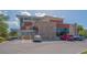 Exterior view of the library showing parking lot and accessible entrances with stone and modern facade at 2406 Breakwater Cir, Sarasota, FL 34231