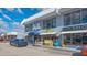 Storefront featuring various businesses with awnings and displays, appealing to thrift and salon shoppers at 2406 Breakwater Cir, Sarasota, FL 34231