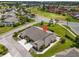 Community house with golf course views surrounded by green grass, beautiful landscaping, and palm trees at 2904 Captains Ct # 2904, Palmetto, FL 34221