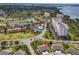 Aerial view of residential neighborhood with golf course, lakes, condos, and single-Gathering homes at 2904 Captains Ct # 2904, Palmetto, FL 34221
