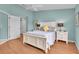 Comfortable bedroom featuring a bright window and wood floors at 2904 Captains Ct # 2904, Palmetto, FL 34221