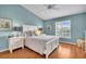 Inviting bedroom with a bright window and wood floors at 2904 Captains Ct # 2904, Palmetto, FL 34221