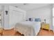 Bright bedroom with a spacious closet, wood floors, and a serene atmosphere at 2904 Captains Ct # 2904, Palmetto, FL 34221
