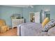 Light-filled bedroom with light blue walls and wood floors at 2904 Captains Ct # 2904, Palmetto, FL 34221