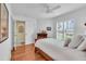 Comfortable bedroom featuring wood floors, white walls, and a bright window at 2904 Captains Ct # 2904, Palmetto, FL 34221