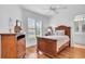 Inviting bedroom with wood floors, a bright window, and tasteful nautical decor at 2904 Captains Ct # 2904, Palmetto, FL 34221