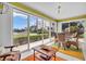 Bright dining area with sliding glass doors, tile floors, and comfortable seating, offering great view at 2904 Captains Ct # 2904, Palmetto, FL 34221