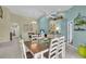 Open dining area with a dark wood table with white chairs, with sightlines to the living room at 2904 Captains Ct # 2904, Palmetto, FL 34221