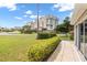 Exterior view of lush manicured lawns surrounding a high rise condo building at 2904 Captains Ct # 2904, Palmetto, FL 34221