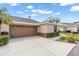 Charming single-story home features attached garage, a well-manicured lawn, neutral stucco at 2904 Captains Ct # 2904, Palmetto, FL 34221