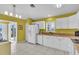 Bright kitchen featuring white cabinets, granite countertops, and a view of the lush outdoors at 2904 Captains Ct # 2904, Palmetto, FL 34221