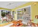Sunlit living room with tile floors, cozy seating, and an open layout that flows into the dining area at 2904 Captains Ct # 2904, Palmetto, FL 34221