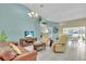 Bright living room features tile floors, comfortable seating, and an open layout to the dining area at 2904 Captains Ct # 2904, Palmetto, FL 34221