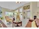 Spacious living room with tile flooring, high ceilings, neutral paint, and an open layout leading to the dining area at 2904 Captains Ct # 2904, Palmetto, FL 34221