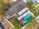 A high-angle view showing a lovely home and backyard oasis, with a kidney shaped pool at 2905 39Th W St, Bradenton, FL 34205