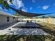 Wonderful backyard deck with a shade sail, ideal for enjoying outdoor living at 3507 65Th Avenue E Cir, Sarasota, FL 34243