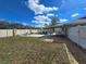 Spacious backyard with patio, fire pit, and outdoor living space perfect for entertaining and relaxation at 3507 65Th Avenue E Cir, Sarasota, FL 34243