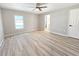 Light and airy bedroom with a window and neutral tones, features a door to the bathroom at 3507 65Th Avenue E Cir, Sarasota, FL 34243