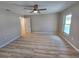 Open bedroom with ceiling fan and attached ensuite at 3507 65Th Avenue E Cir, Sarasota, FL 34243