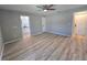 Spacious bedroom with modern lighting and ample room, enhanced by a neutral color scheme and clean finishes at 3507 65Th Avenue E Cir, Sarasota, FL 34243