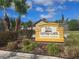 Centre Lake community entrance sign surrounded by lush landscaping and palm trees at 3507 65Th Avenue E Cir, Sarasota, FL 34243