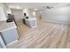 Cozy dining area featuring modern flooring leading into the living area and kitchen at 3507 65Th Avenue E Cir, Sarasota, FL 34243