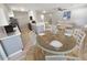 Dining area adjacent to the kitchen and living space, fully furnished for a Gathering meal with stainless steel appliances at 3507 65Th Avenue E Cir, Sarasota, FL 34243