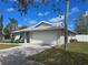Well-maintained single-story home with a spacious two-car garage and nice landscaping at 3507 65Th Avenue E Cir, Sarasota, FL 34243