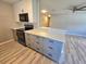 Well-lit kitchen featuring stainless steel appliances, lots of cabinet space, and a lovely breakfast bar at 3507 65Th Avenue E Cir, Sarasota, FL 34243