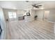 Bright, open-concept living area with clean, modern finishes; blending kitchen, living and dining spaces for a spacious feel at 3507 65Th Avenue E Cir, Sarasota, FL 34243