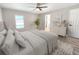 Cozy bedroom with a neutral color palette, carpet flooring and soft natural light, creating a serene retreat at 3507 65Th Avenue E Cir, Sarasota, FL 34243