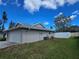 Home exterior featuring a well-maintained lawn and privacy fencing at 3507 65Th Avenue E Cir, Sarasota, FL 34243