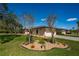 Well-maintained home featuring a manicured lawn, beautiful landscaping, and a two-car garage at 3641 Gleneagle Dr # 12D, Sarasota, FL 34238