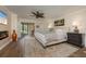 Serene main bedroom with a plush bed, area rug, stylish decor, and outdoor access at 3641 Gleneagle Dr # 12D, Sarasota, FL 34238